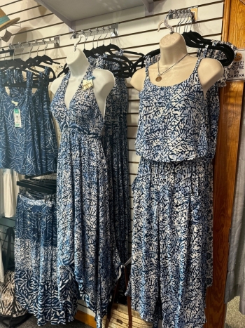Cathy's Boutique display of merchandise including dresses and tropical wear