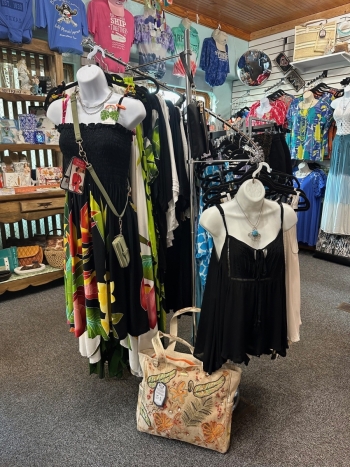 Cathy's Boutique display of merchandise including dresses and tropical wear