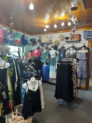 Cathy's Boutique display of merchandise including dresses and tropical wear