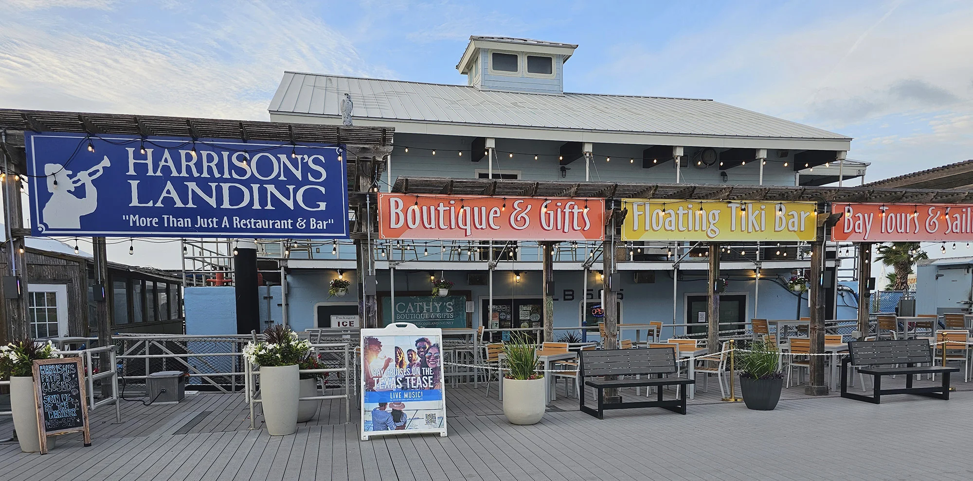 Table filled with various delicious dishes and colorful drinks at Harrison's Landing